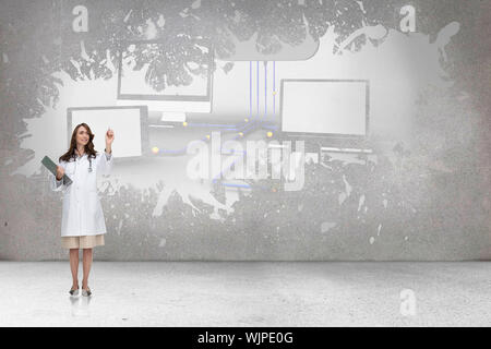 Smiling doctor pointing against splash on wall revealing cloud computing concept Stock Photo