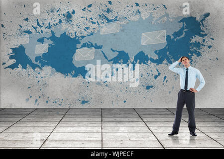 Thoughtful businessman with hand on head against splash showing global communications Stock Photo