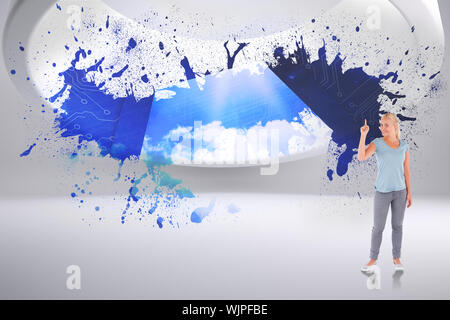 Charming woman pointing against splash showing cloud computing Stock Photo