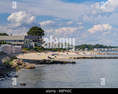 Niantic, Connecticut USA, Aug 22, 2019 - Residents of this New England small town and vacationers enjoy a summer day by the sea at Black Point Beach. Stock Photo