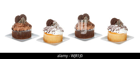 Chocolate and vanilla giant cupcakes on square plates isolated on white. Social media banner format Stock Photo