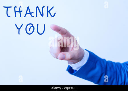 Word writing text Thank You. Business photo showcasing polite expression used when acknowledging gift service compliment Isolated hand pointing with f Stock Photo