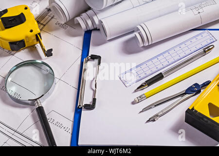 set of architect tools on  blueprints Stock Photo
