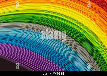Paper strips in rainbow colors as a colorful backdrop Stock Photo