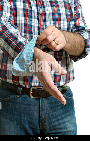 Man in jeans and a plaid shirt rolls up his sleeves, isolated on white background Stock Photo