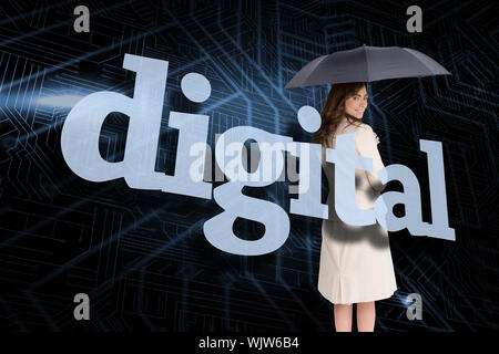 Businesswoman holding umbrella behind the word digital against circuit board Stock Photo