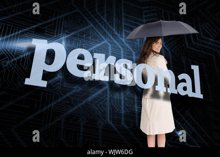 Businesswoman holding umbrella behind the word personal against circuit board Stock Photo