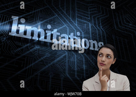 The word limitations and smiling businesswoman thinking against futuristic black and blue background Stock Photo