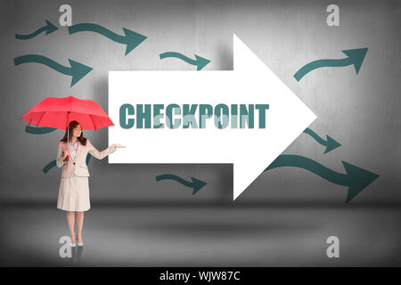 The word checkpoint and attractive businesswoman holding red umbrella against arrows pointing Stock Photo