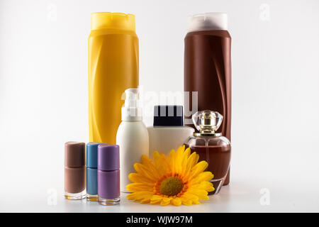 Care set consisting of shampoo, poarfum, lotion, soap, nail polish, sun cream. Isolated on white background Stock Photo