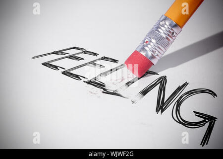 Pencil erasing the word feeling on paper Stock Photo