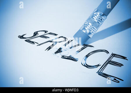 Pencil erasing the word service on paper Stock Photo