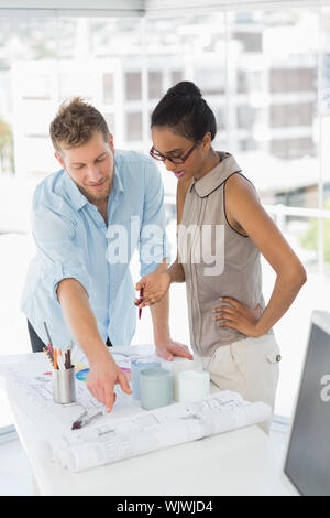 Business partners, interior designers are talking in the lobby of a ...
