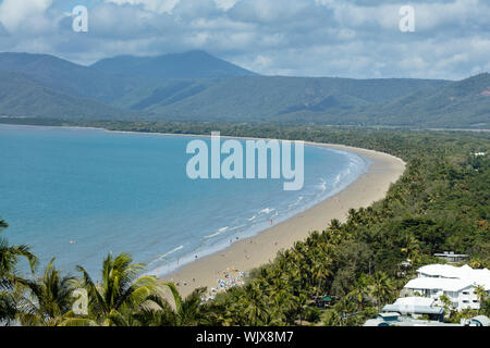 Port Douglas, Queensland, Australia. Four Mile Beach at Port Douglas with the dramatic backdrop of cloud covered mountains in tropical Far North Queen Stock Photo