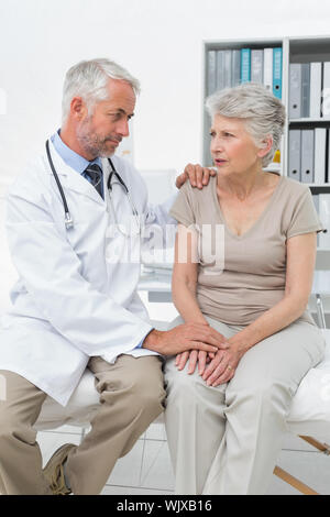 Female senior patient visiting a doctor at the medical office