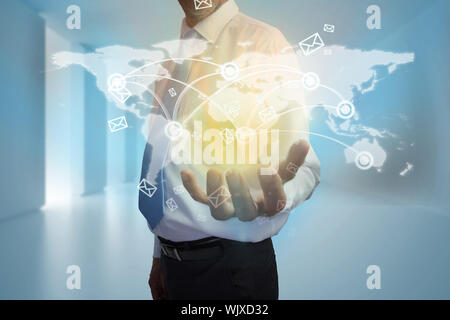 Digital composite of businessman presenting map interface with email Stock Photo