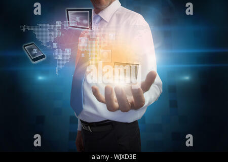 Digital composite of businessman presenting interface with connecting devices Stock Photo