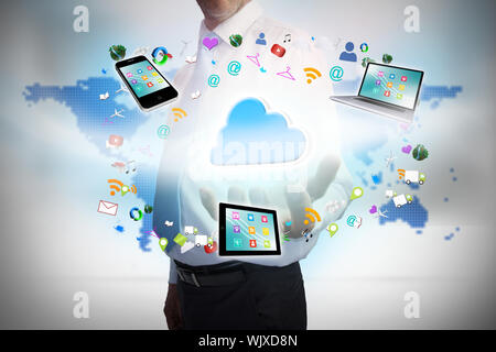 Digital composite of businessman presenting cloud computing graphic Stock Photo