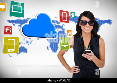 Digital composite of glamorous brunette using smartphone with cloud and icons Stock Photo