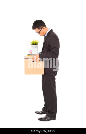 Businessman loses his job with carrying his belongings Stock Photo