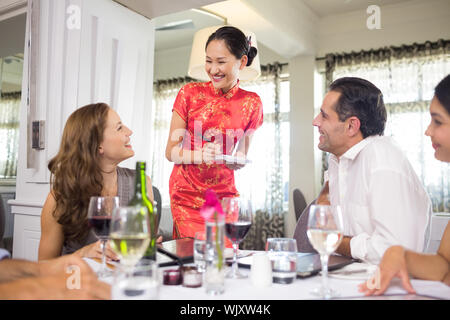 Business colleagues sitting around dining table in the restaurant Stock Photo