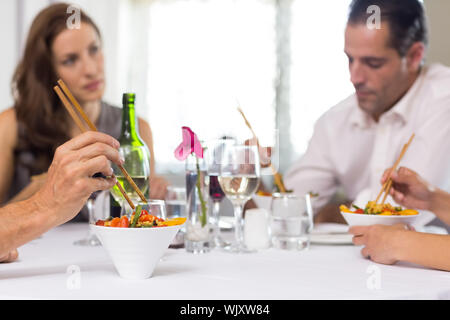 Business colleagues sitting around dining table in the restaurant Stock Photo