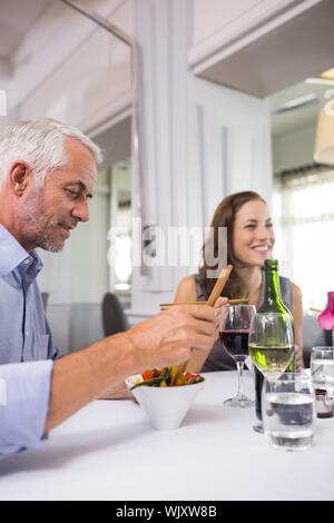 Business colleagues sitting around dining table in the restaurant Stock Photo