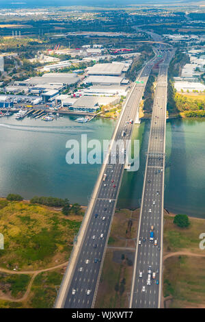 Vertical aerial view of the Sir Leo Hielscher Bridges or Gateway Bridge on the Gateway Motorway M1 in Brisbane, Queensland, QLD, Australia Stock Photo