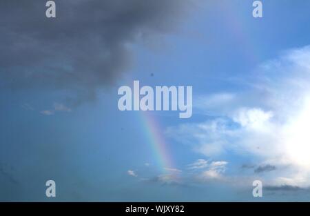 A Very Soft Rainbow Appears On The Sky, Beautiful Natural View After Rain Stock Photo