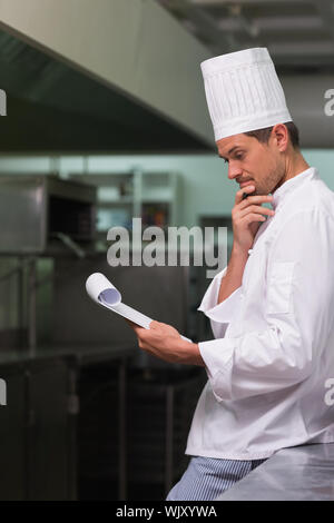 Head chef planning the menu in a commercial kitchen Stock Photo - Alamy