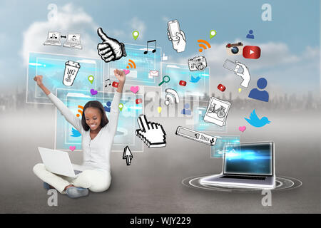 Digital composite of cheering girl using laptop with app icons Stock Photo