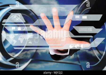Digital composite of hand touching interface Stock Photo
