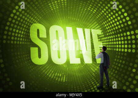 The word solve and businessman holding his jacket against green pixel spiral Stock Photo