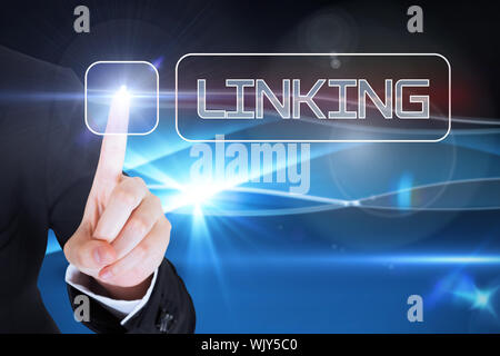 Businesswomans finger touching linking button against blue technology background Stock Photo