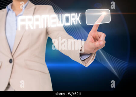 Businesswomans finger touching framework button against shiny lines on black background Stock Photo