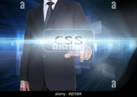 The word css and businessman pointing against shiny arrow lines on black background Stock Photo