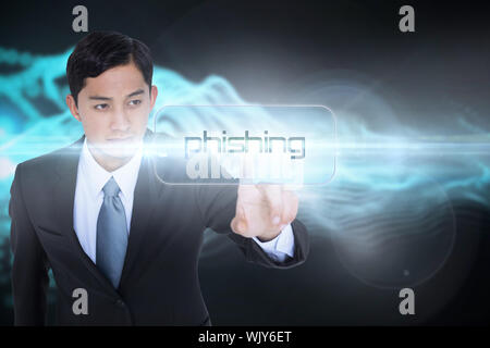 The word phishing and unsmiling asian businessman pointing against abstract blue glowing black background Stock Photo