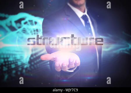 The word structure and businessman presenting against abstract blue glowing black background Stock Photo
