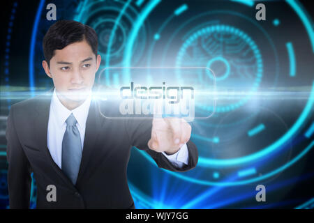 The word design and unsmiling asian businessman pointing against futuristic technological background Stock Photo