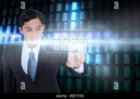 The word protection and unsmiling asian businessman pointing against glowing codes on black background Stock Photo