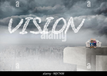 The word vision and silly employees with arms folded wearing boxes on their heads against balcony overlooking city Stock Photo