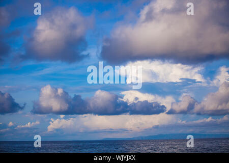 Blue sky with a heap, white clouds Stock Photo