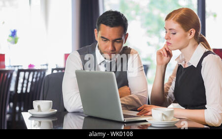 Business team working together in a cafe Stock Photo