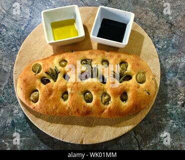 High Angle View Of Bread On Cutting Board
