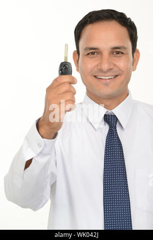 Sales executive showing car key Stock Photo