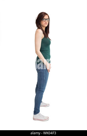 Unsmiling young woman with glasses posing Stock Photo