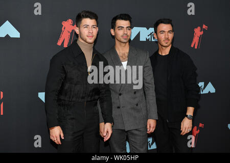 Jonas Brothers - Nick Jonas, Joe Jonas and Kevin Jonas attend the 2019 MTV Video Music Awards at Prudential Center on August 26, 2019 in Newark, New J Stock Photo