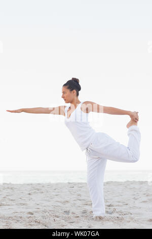 Woman in lord of the dance yoga pose Stock Photo - Alamy