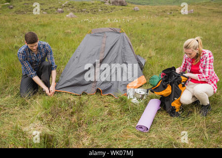 Couple pitching their tent Stock Photo