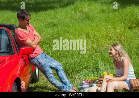 Smiling couple having picnic together Stock Photo